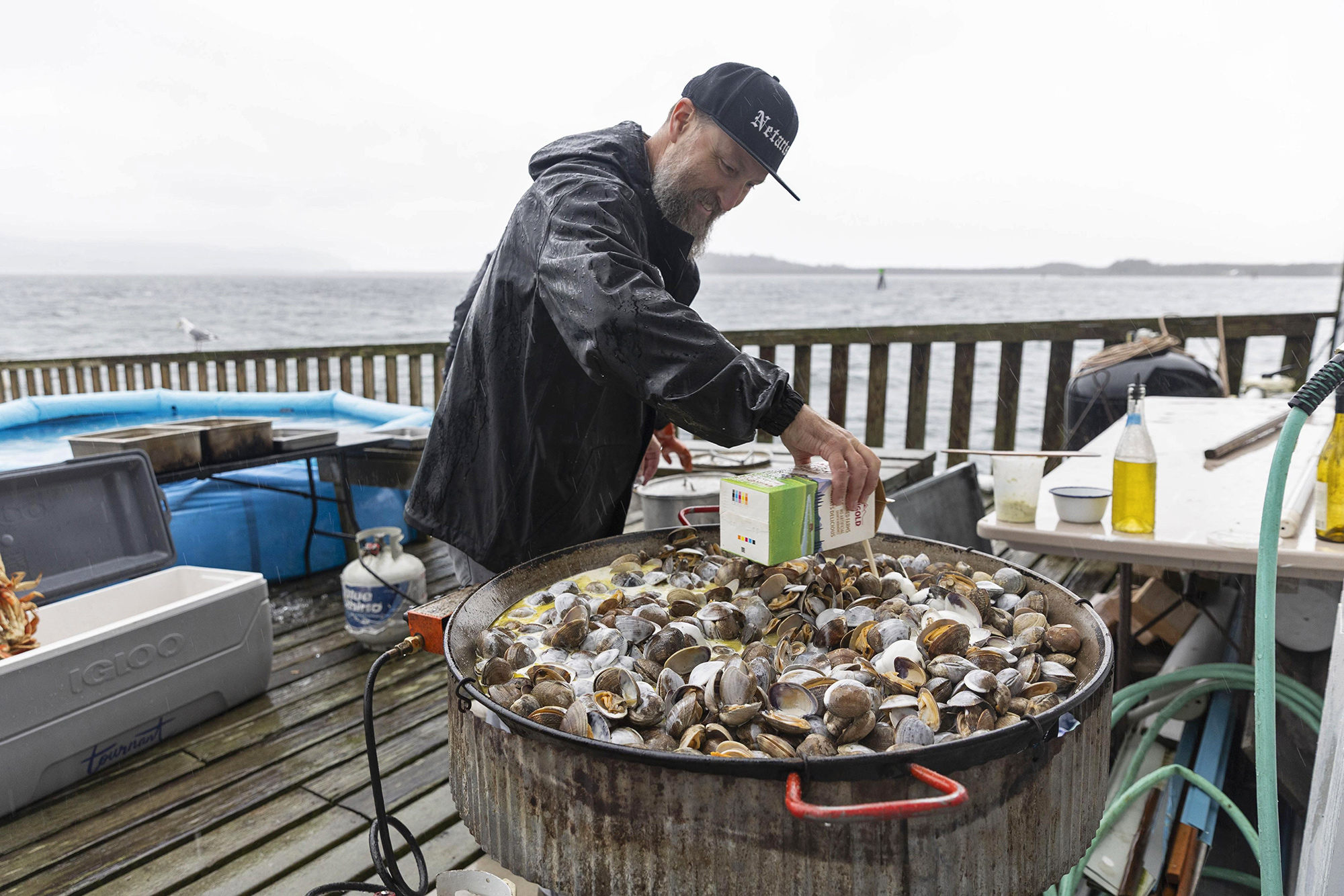chef cooking steamed clams outdoor